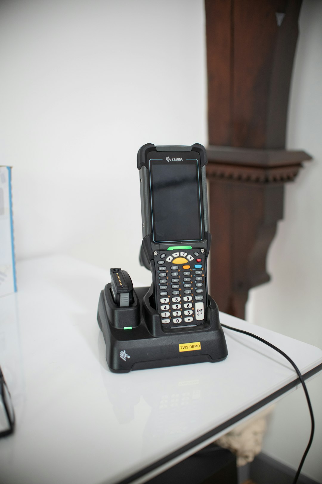 Barcode scanner device in charging dock on table