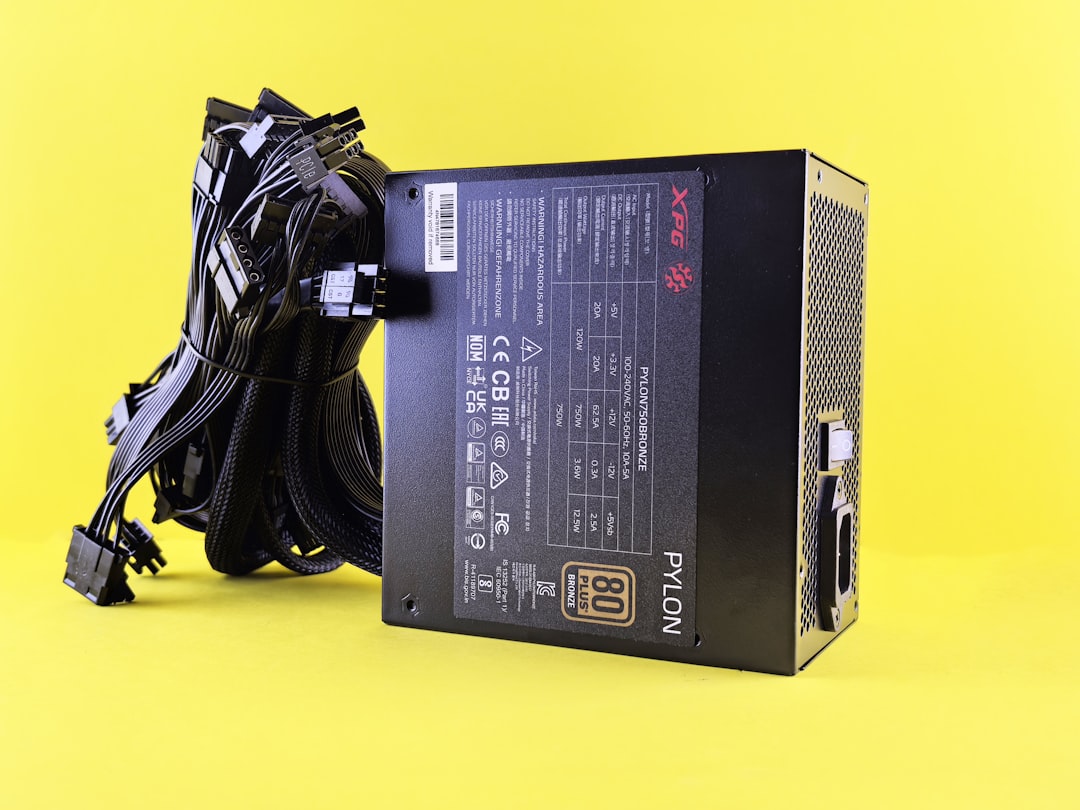 Black computer power supply unit with cables