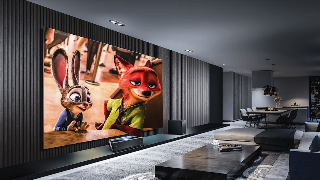 A large screen displaying an animated rabbit and fox in a modern living room